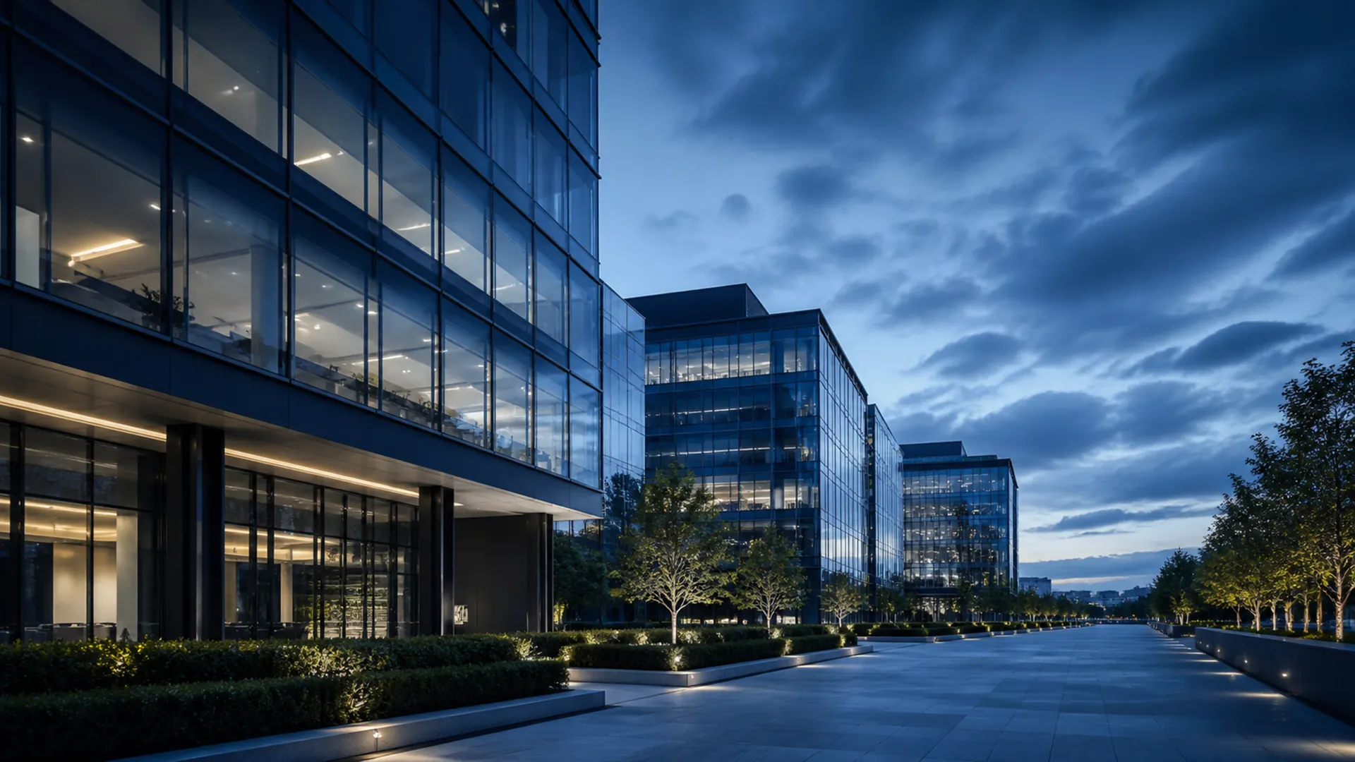 Modern glass office buildings at dusk